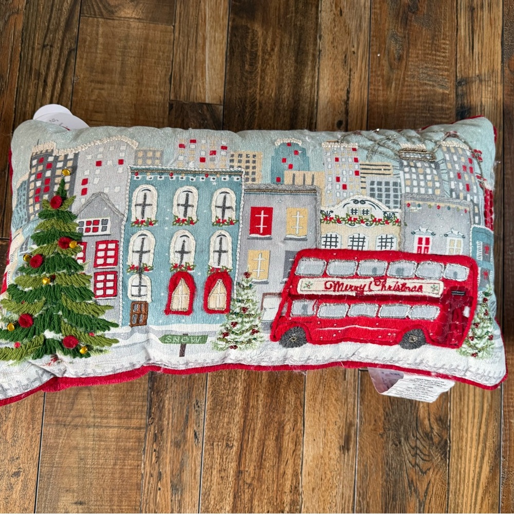 Festive Cityscape Holiday Pillow with Red Bus